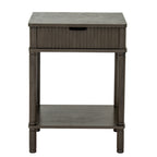Front view of the Reed & Cup Side Table with a centred dark cup pull, vertical reeding and four turned-profile legs around an open shelf.