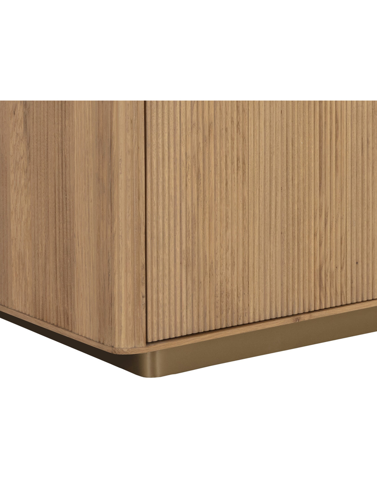 Detail of the sideboard's reeded door front, rounded wood corner and brushed gold base.