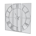Angled view of the Reflected Dial Wall Clock, with a silver-toned Roman-numeral dial spanning three tall mirrored panels.