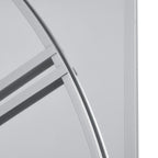 Detail of the silver-toned dial curve and numeral bars against the mirror, beside a straight rectangular panel border.