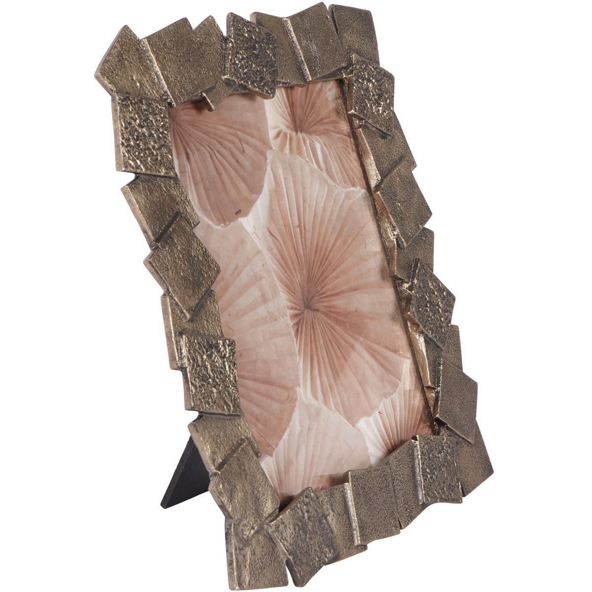 Angled front view of the antiqued gold photo frame with overlapping square motifs, a pink botanical insert and easel visible behind.