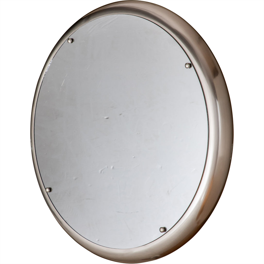 Angled view of the unilluminated circular mirror, showing its reflective face and rounded outer rim.