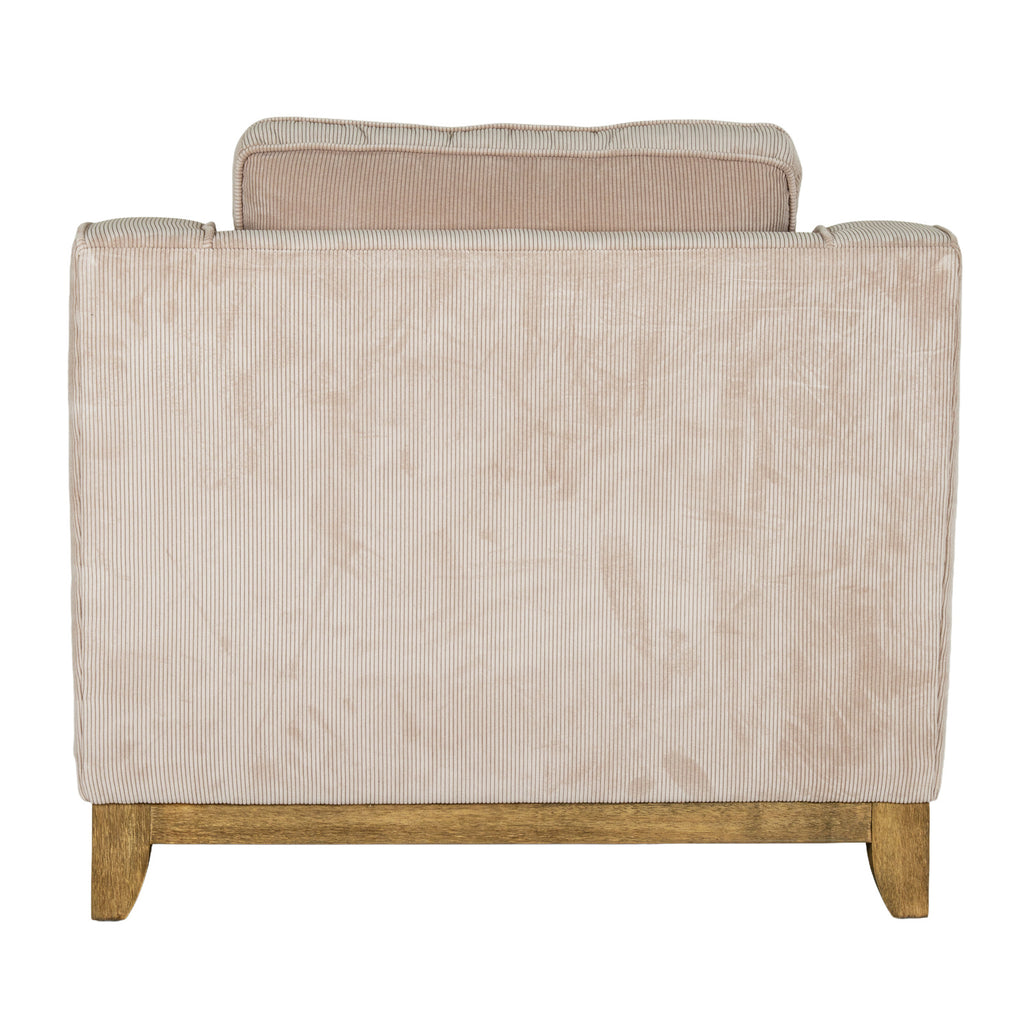 Rear view of the armchair showing the cream ribbed back, the back cushion above it, and a brown lower rail between the feet.