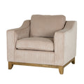Angled front view of a cream ribbed armchair with rising arms, seat and back cushions, and brown lower rails and feet.