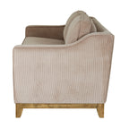 Side view of the sofa showing the upholstered arm rising towards the back above a brown lower rail and feet.