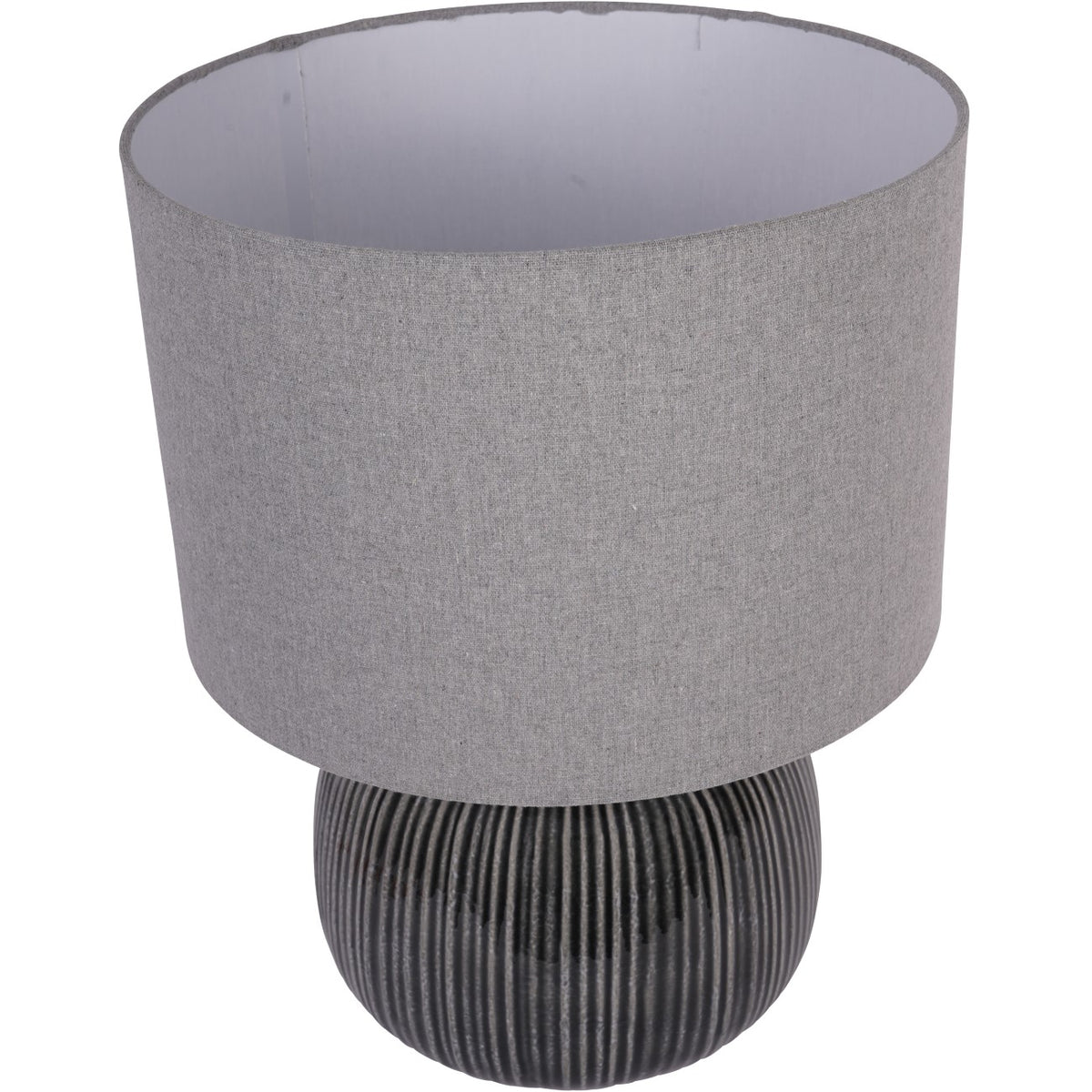 Table lamp viewed from above, showing the pale shade interior and ribbed charcoal base.