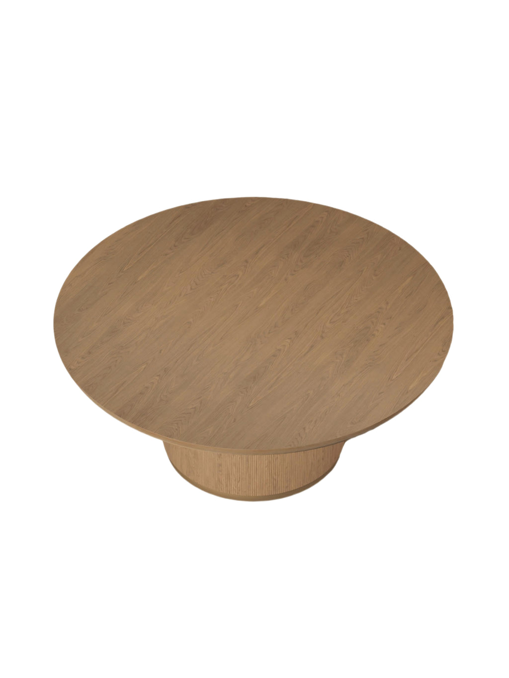 Dining table viewed from above at an angle, showing the circular wooden top and its grain with the ribbed pedestal visible below.
