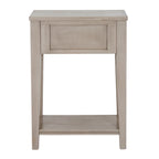 Rear view of the pale table with a framed rectangular back panel, open space between the legs and a low shelf.