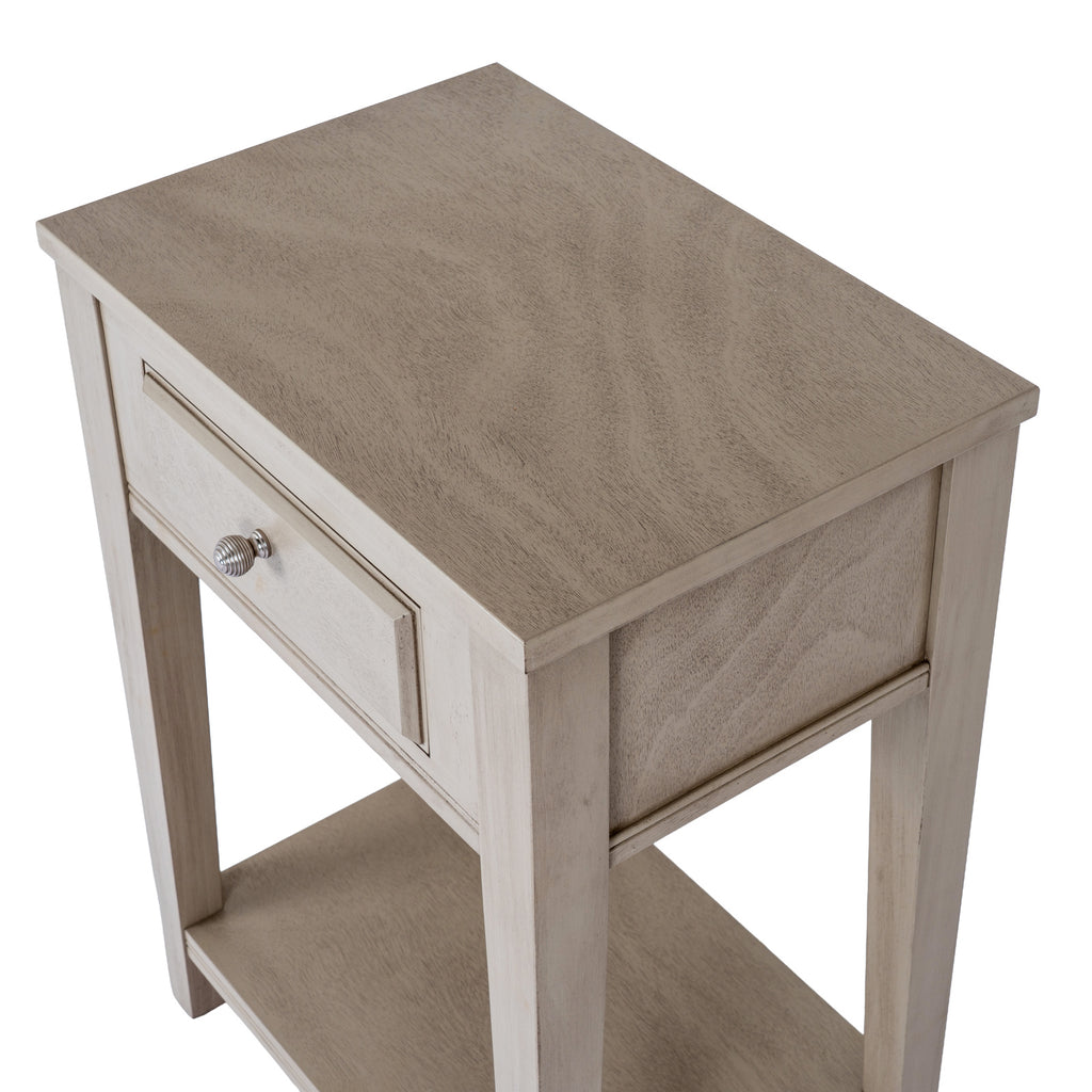 Angled view from above showing the grain across the table's straight-edged top, closed drawer and side panel.