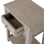View from above with the drawer pulled open, showing its empty interior beneath the grained rectangular tabletop.