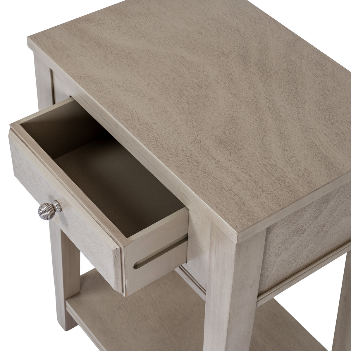 View from above with the drawer pulled open, showing its empty interior beneath the grained rectangular tabletop.