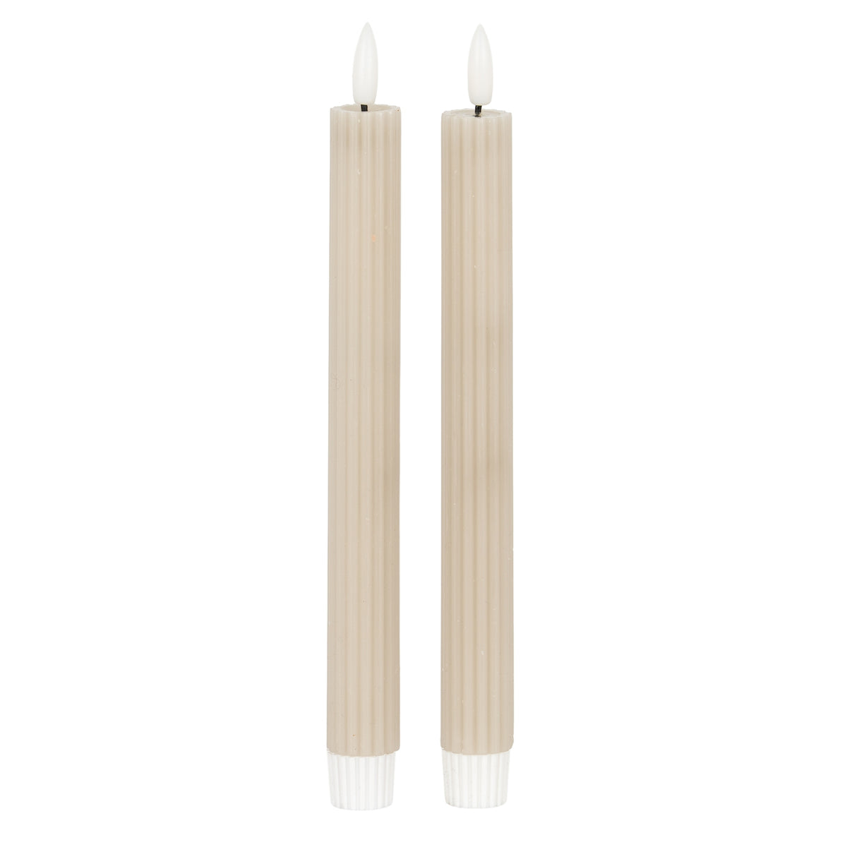 Two slender pale beige-taupe ribbed candles with white flame-shaped tips and white lower fittings against a white background.