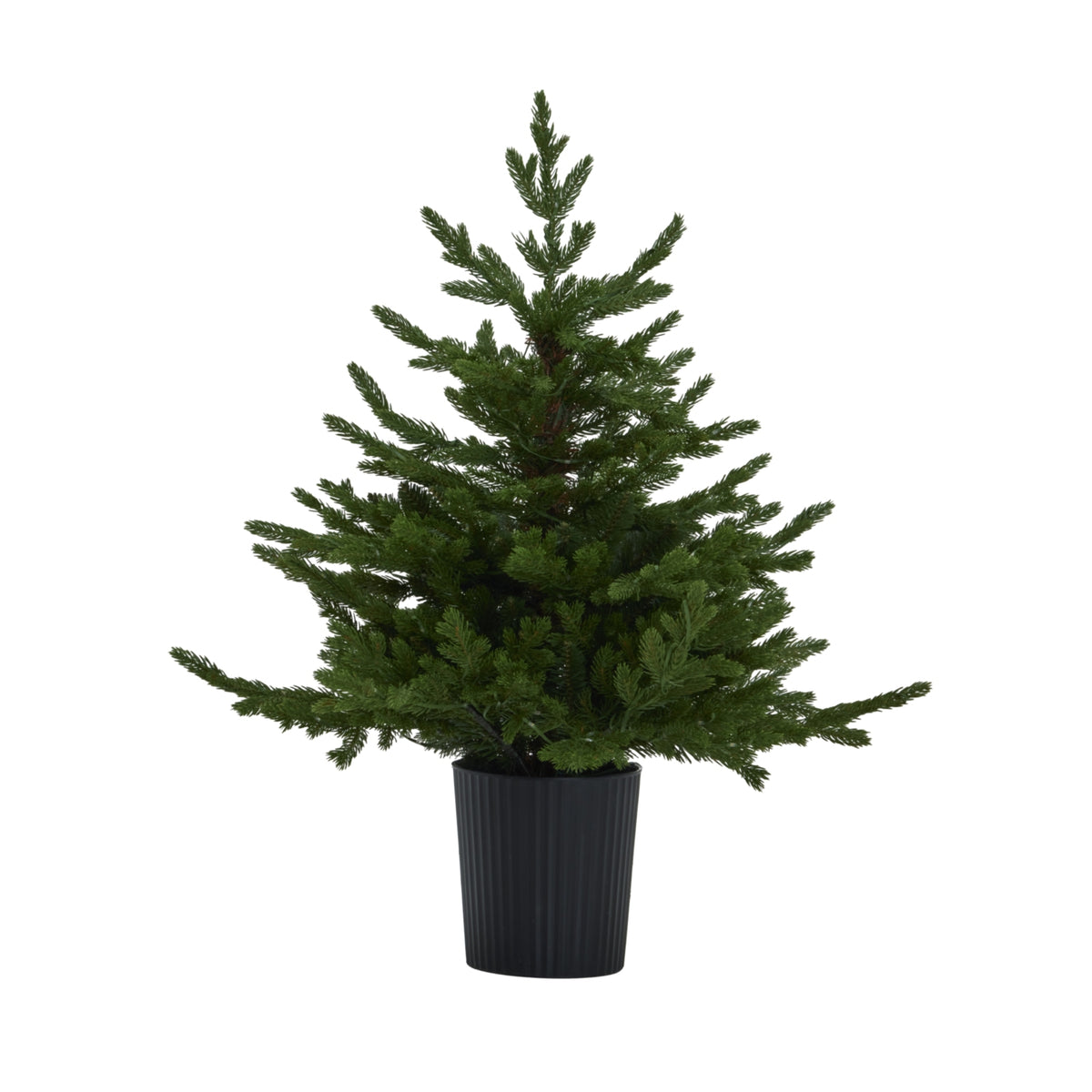Full view of the green artificial Christmas tree without lights glowing, showing its pointed top, wide lower branches and black ribbed pot.