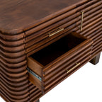 Close angled view of an open drawer beneath the closed top drawer, with gold-toned handles and horizontal brown ridges.