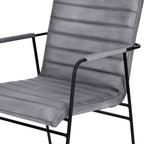 Close view of the grey leather seat and ridged back showing horizontal stitching, edge seams and upholstered armrests.