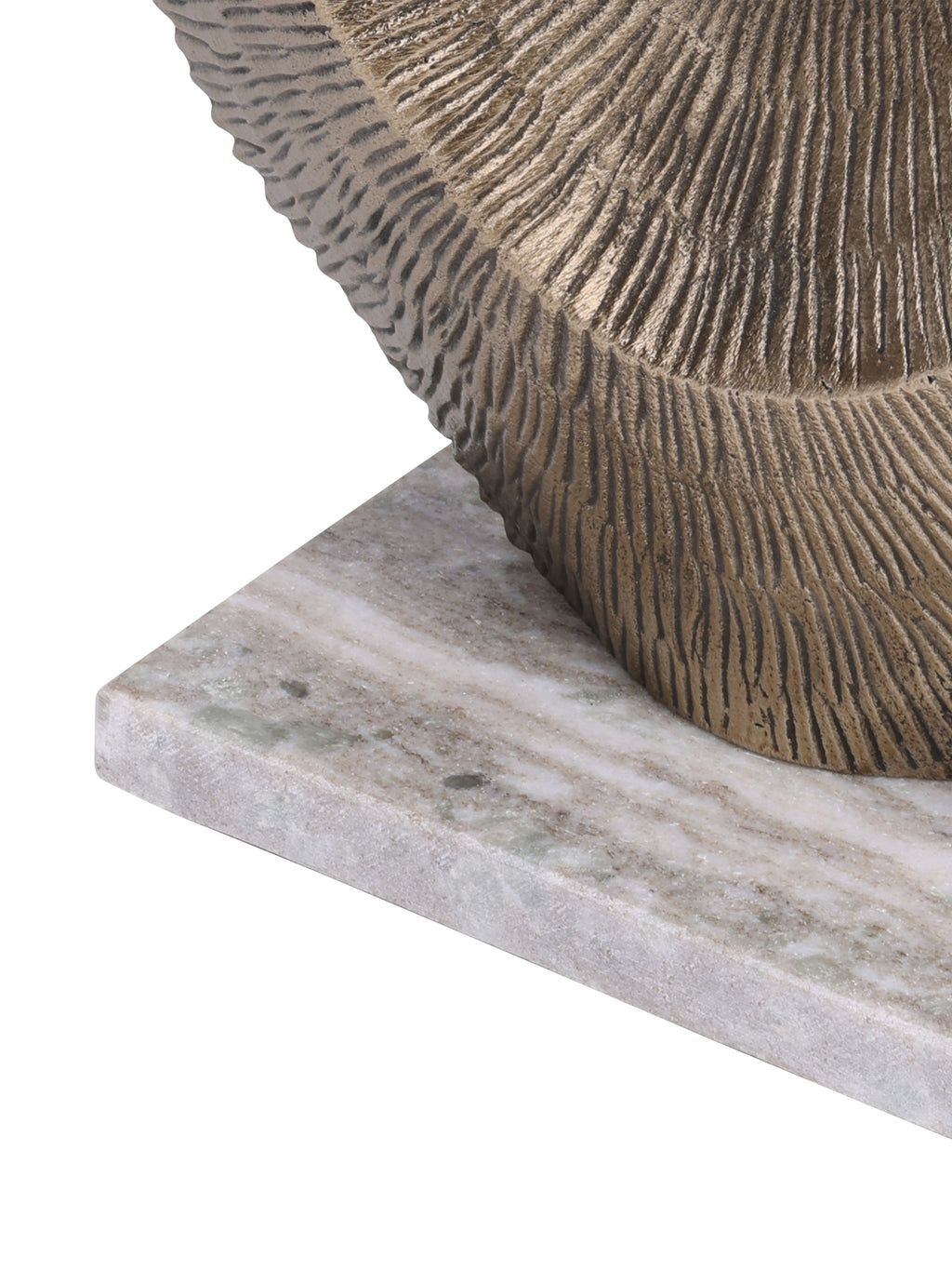 Detail of the ridged gold sculpture meeting its pale veined rectangular marble base.