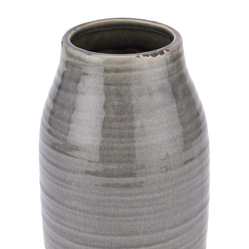 Close-up of the vase's open rim and shoulders, showing fine crackle lines in the glossy grey glaze and dark worn-looking marks along the edge.