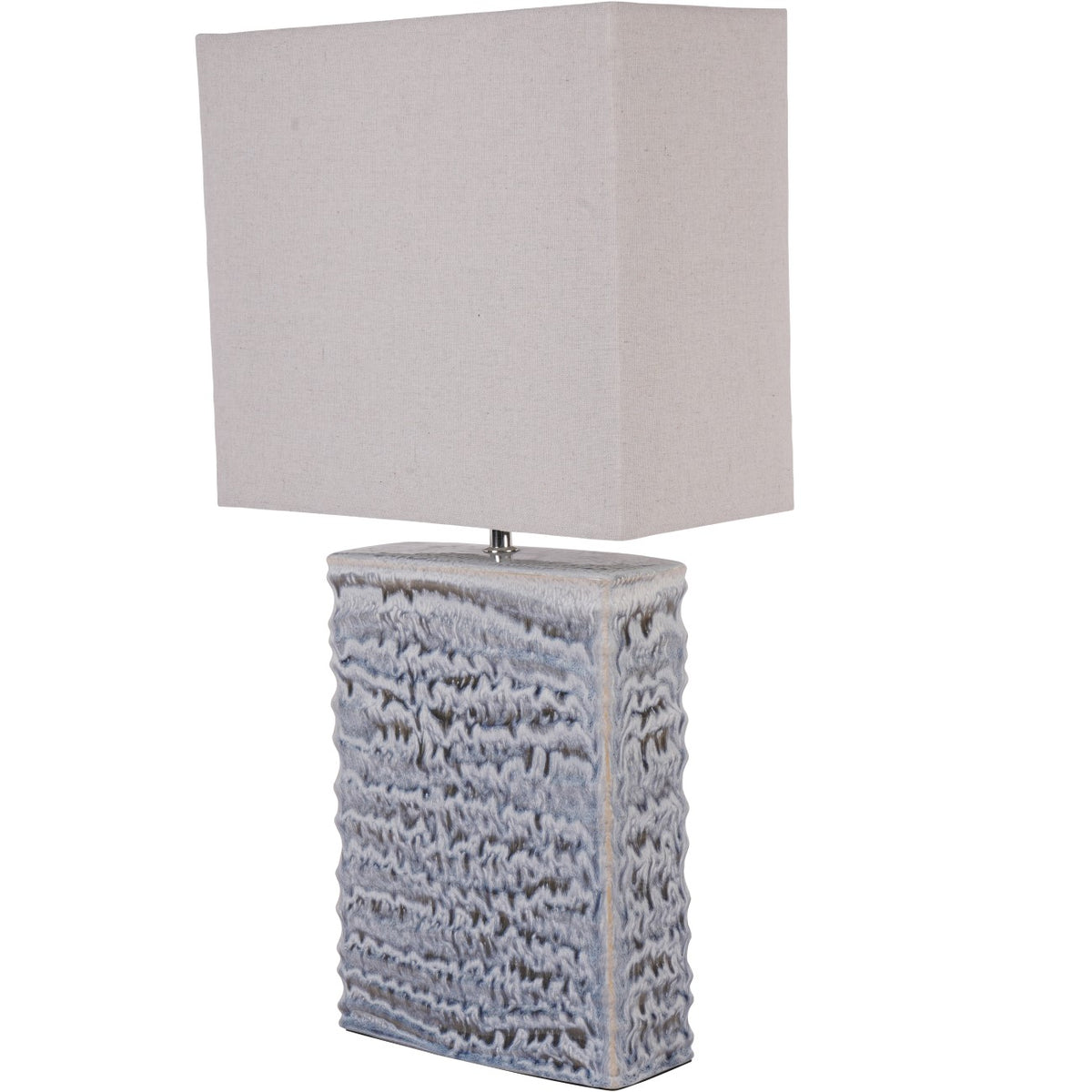 Rill Table Lamp in three-quarter view, showing its rippled blue-grey rectangular base and wider pale linen shade.