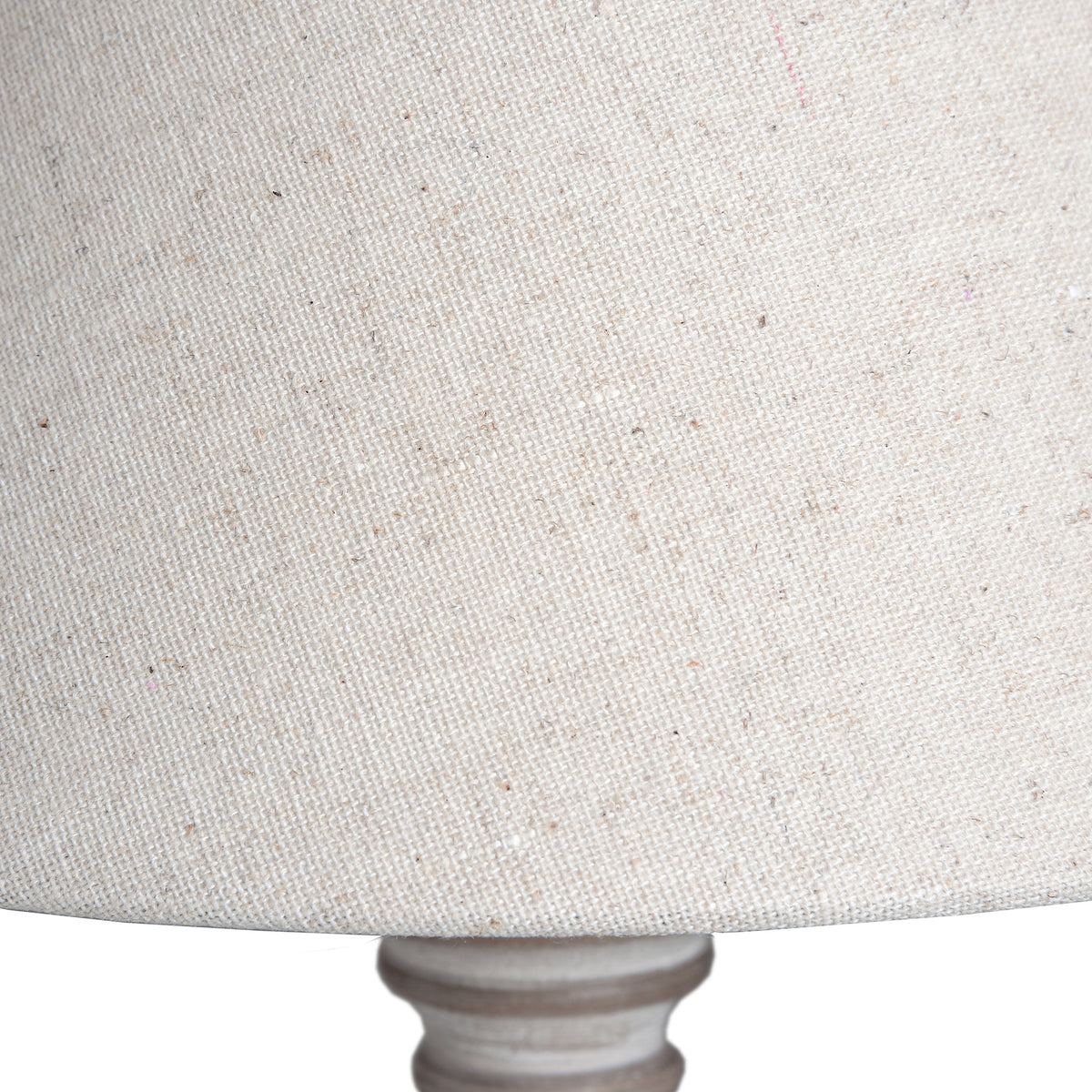 Close-up of the light lampshade showing its coarse woven texture and scattered coloured flecks.