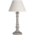 Ring & Bulb Table Lamp with a light tapering shade, grey-brown turned base and circular foot against white.