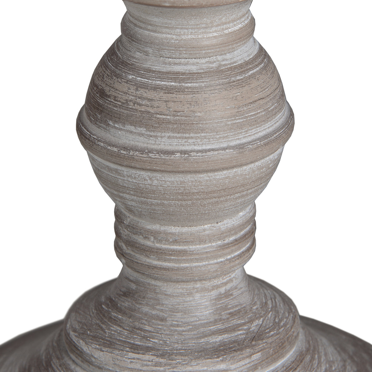 Close-up of the rounded lower lamp base, showing concentric ridges and uneven pale streaks across the grey-brown surface.