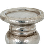 Close-up of the candle holder's recessed platform and rolled rim above the ringed neck, showing mottled silver-coloured detailing.