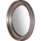 Angled view of the circular mirror showing the curved glass and depth of the ringed silver-toned wooden frame.