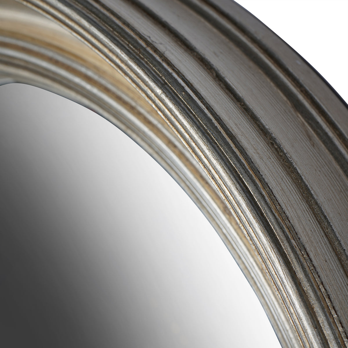 Close-up of the upper curved frame showing fine brush texture, silver highlights and dark grooves between the rings.