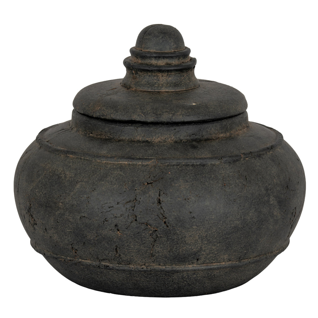 Charcoal-black squat decorative pot with its lid in place, showing a rounded ringed finial, raised shoulder band and mottled surface.