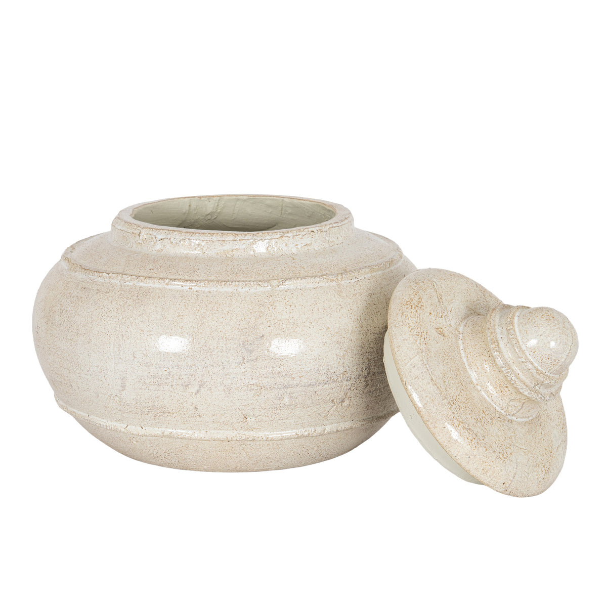 Open decorative pot viewed from the front, with its cream speckled lid leaning beside the rounded body on the right.