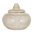 Cream speckled decorative pot with its stepped lid in place, showing the rounded body, raised bands and ringed finial.