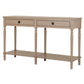 Angled front view of a pale beige-grey console table with two framed drawers, black ring pulls, six shaped legs and one continuous lower shelf.