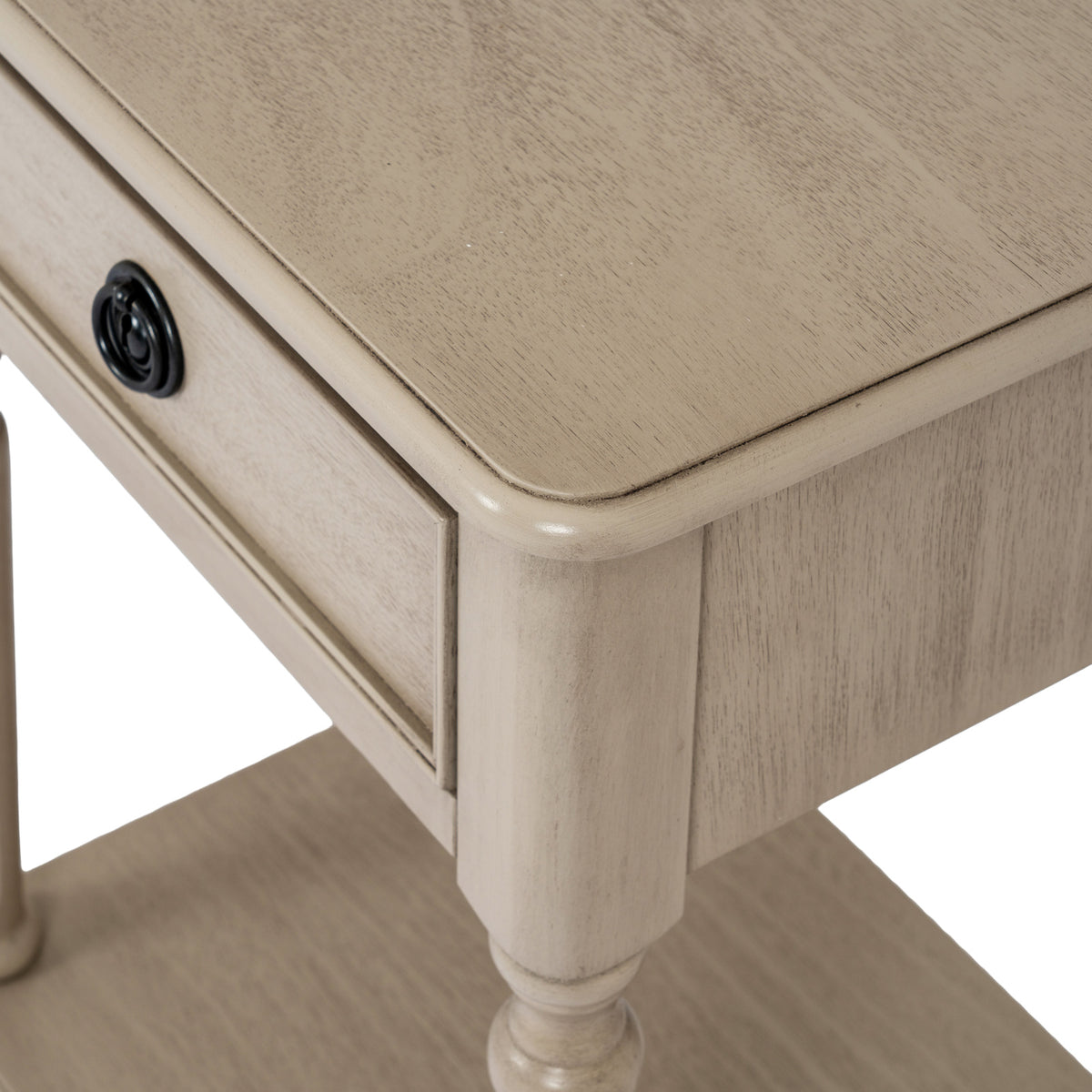 Angled close-up of the Ringline Side Table's rounded top corner, fine grain markings and pale side panel.
