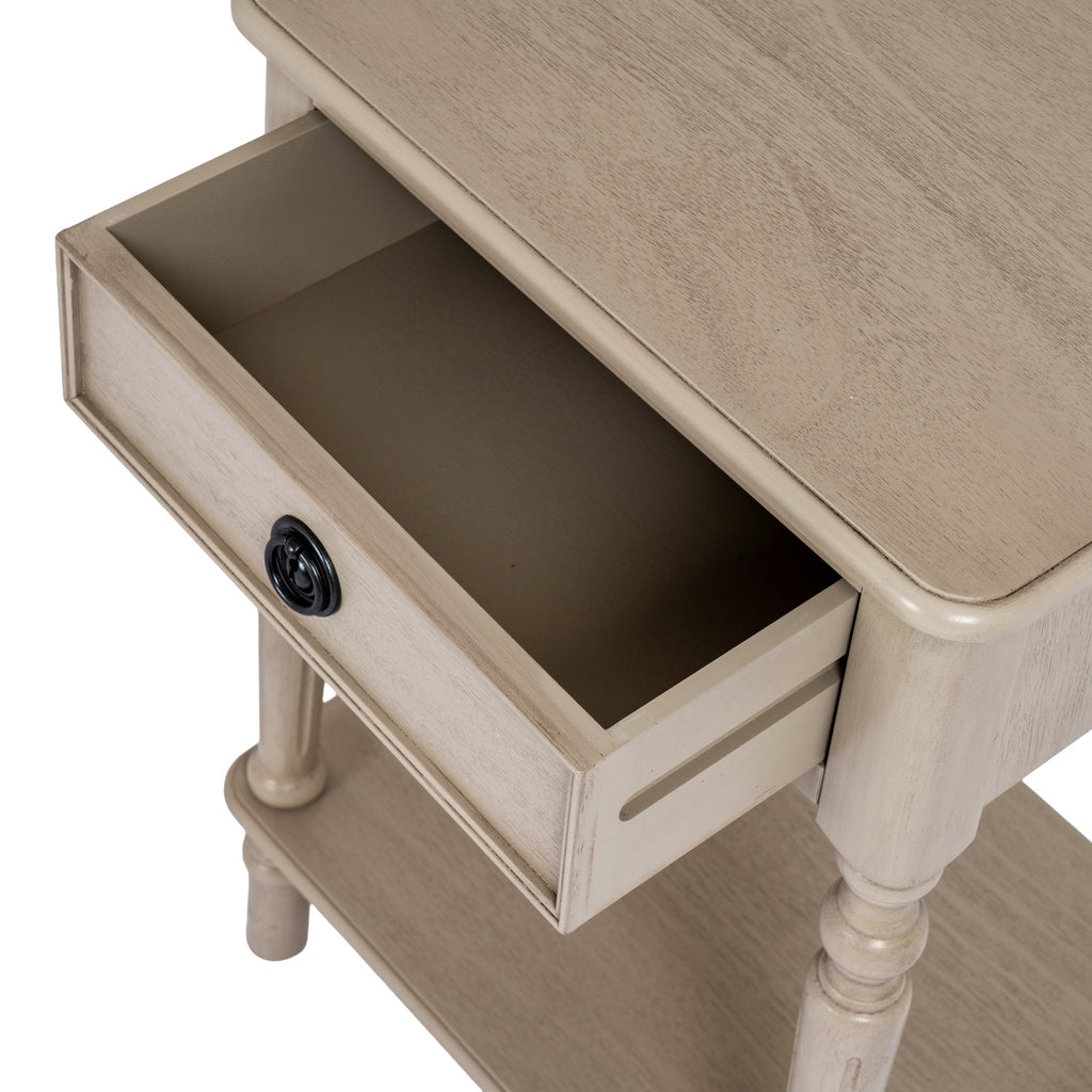 Overhead detail of the Ringline Side Table with its drawer pulled open beneath the pale grained tabletop.
