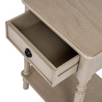 Overhead detail of the Ringline Side Table with its drawer pulled open beneath the pale grained tabletop.