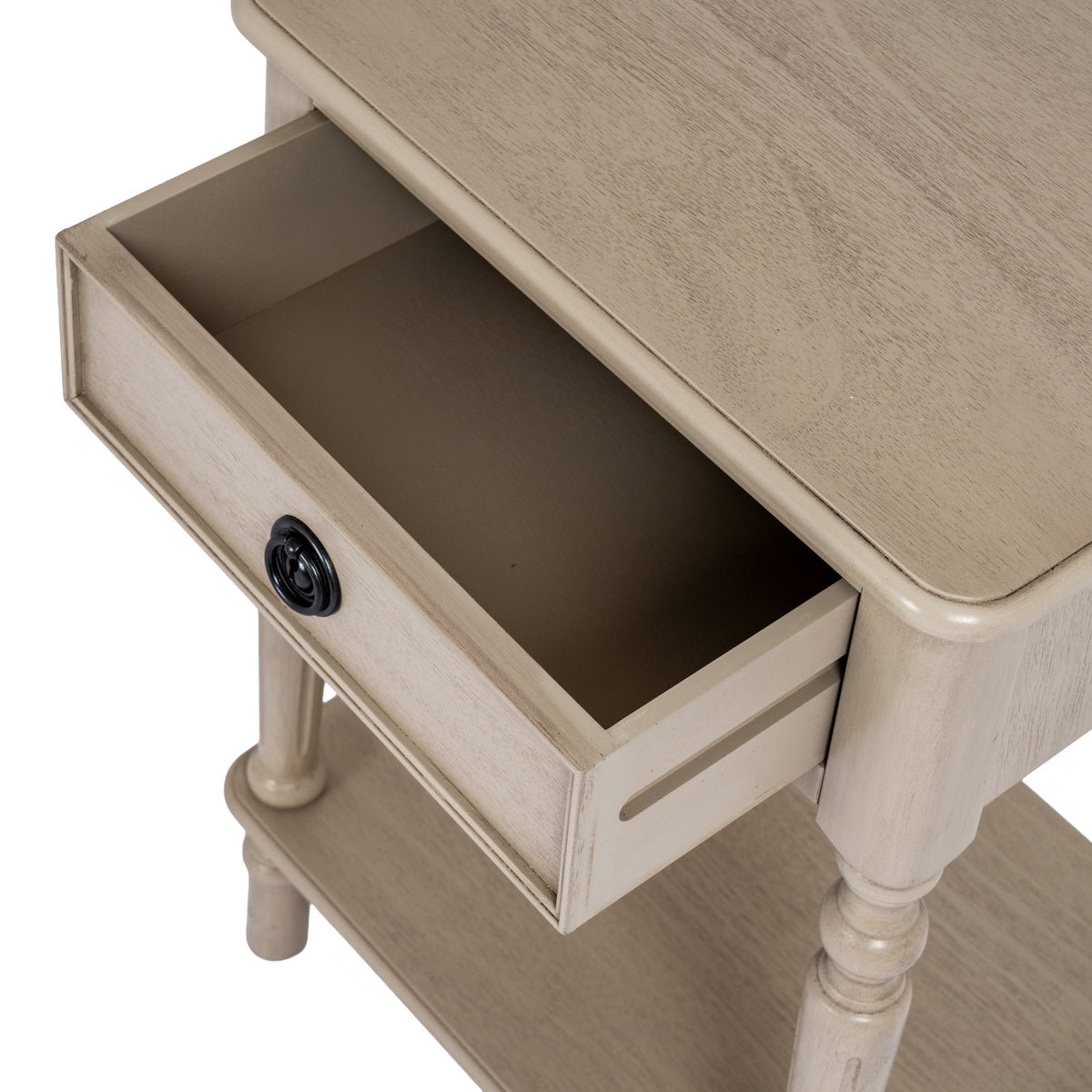Overhead detail of the Ringline Side Table with its drawer pulled open beneath the pale grained tabletop.
