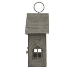 Side view of the house candle holder with a single four-pane window opening beneath the ridged roof and circular top ring.