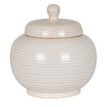 Cream-white ribbed jar with its domed lid in place, rounded knob and narrow raised foot against a white background.