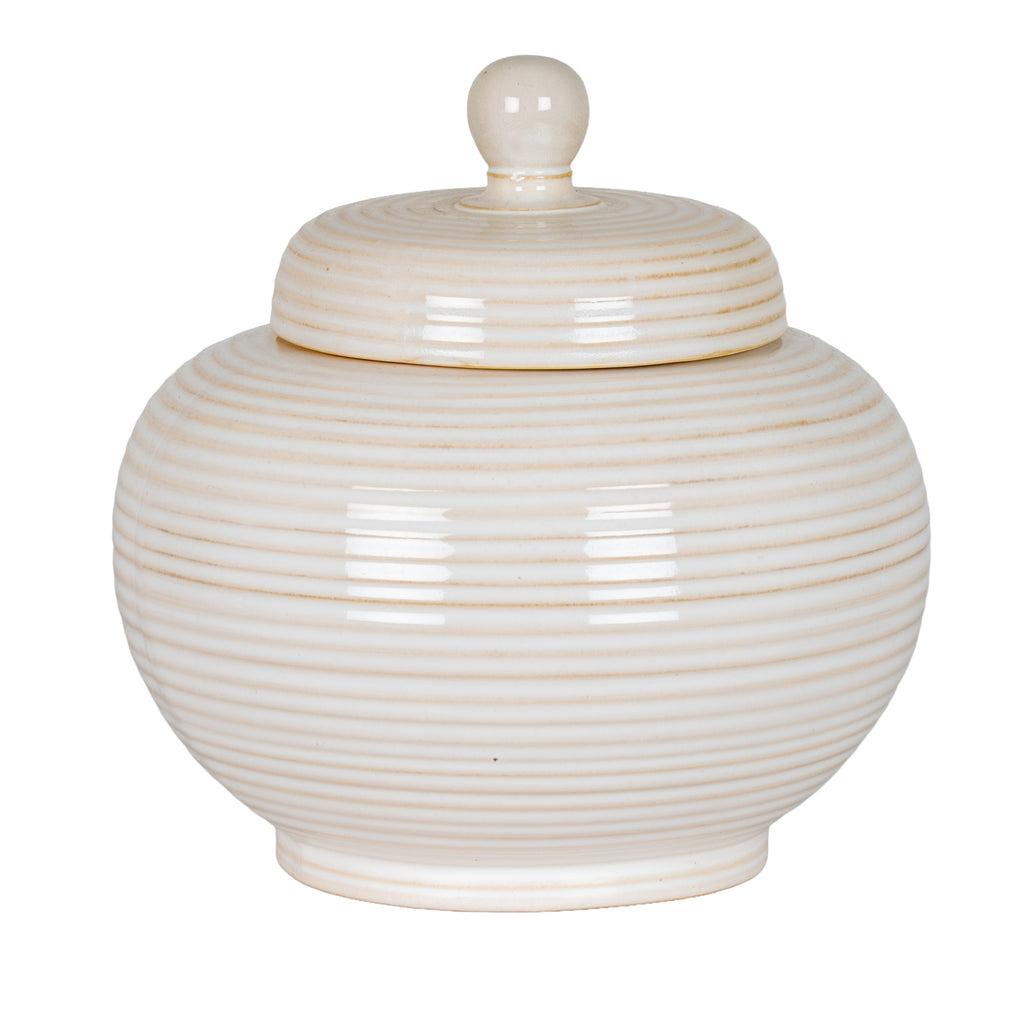 Cream-white rounded jar with horizontal rings, a narrow foot and a fitted stepped lid topped by a round knob.