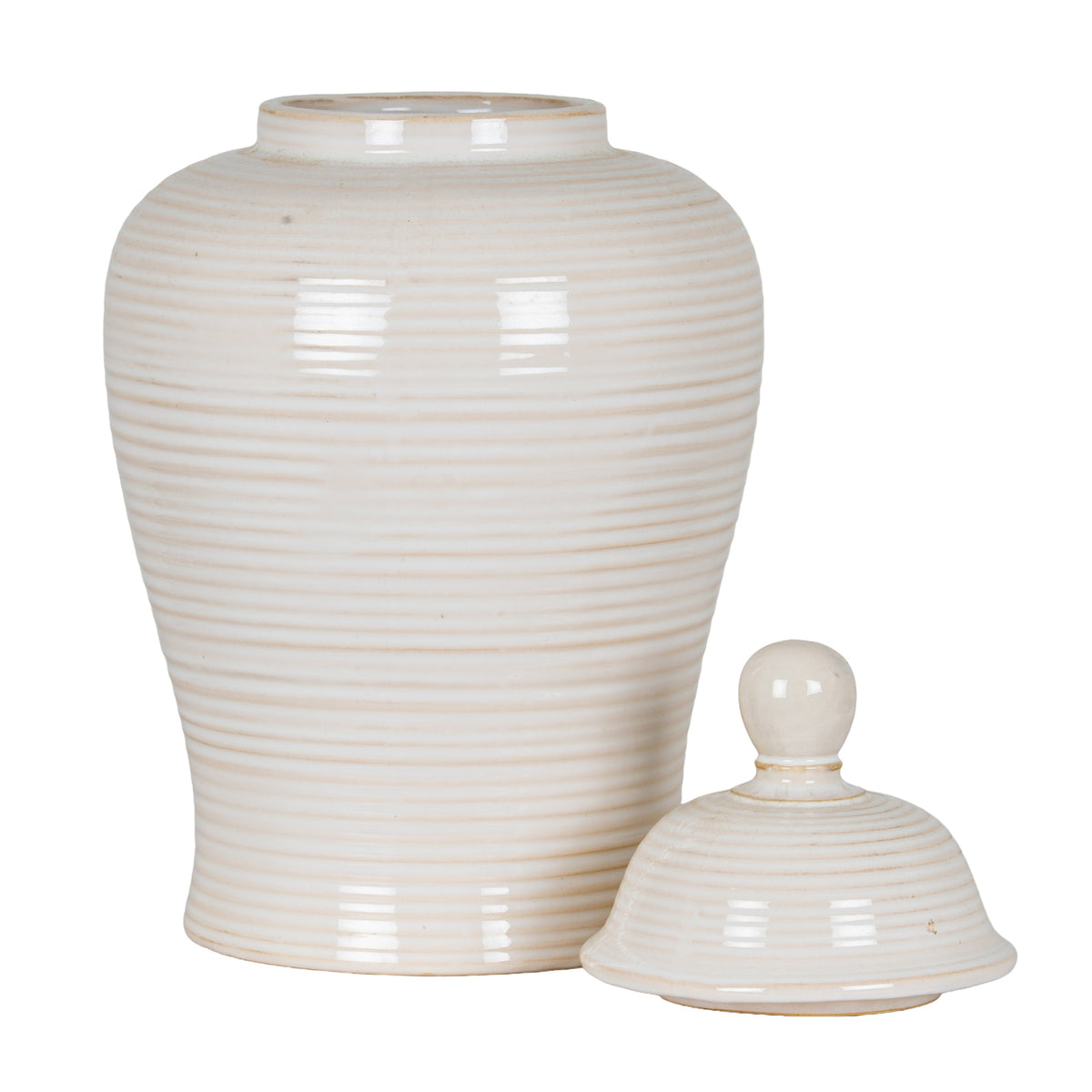 Open ribbed cream-white jar with its domed lid resting beside the body, showing the circular mouth and tapering shape.