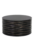 Ripple Drum Coffee Table shown from a slightly elevated angle on a white background, revealing the flat round top and undulating horizontal ridges around the drum body.