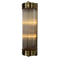Illuminated Rod Shade Wall Light at a slight angle, with vertical glass rods, antique-brass-finished end bands and a rectangular backplate.