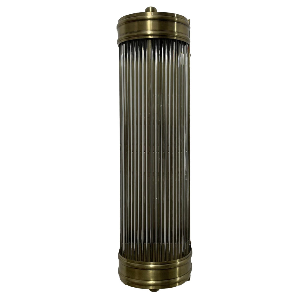 Unlit Rod Shade Wall Light showing its tall curved glass-rod shade, broad antique-brass-finished bands and rounded top and bottom details.