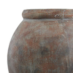 Close-up of the planter's rolled lip and curved shoulder, with pale grey streaks and darker patches across the brown finish.