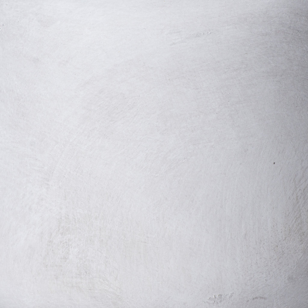 Close-up of the vase surface with soft grey mottling, fine brushed marks and small textured patches.