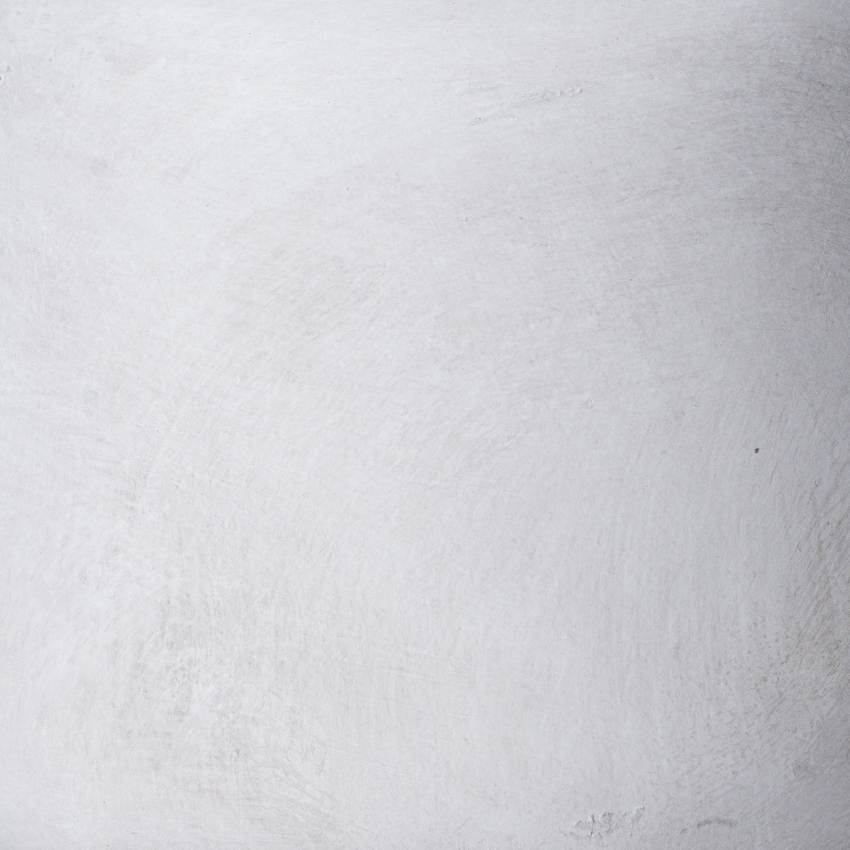 Close-up of the vase surface with soft grey mottling, fine brushed marks and small textured patches.