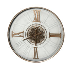 Front view of a round white wall clock with antique gold-toned Roman numerals, hands and exposed cog detailing at the centre.