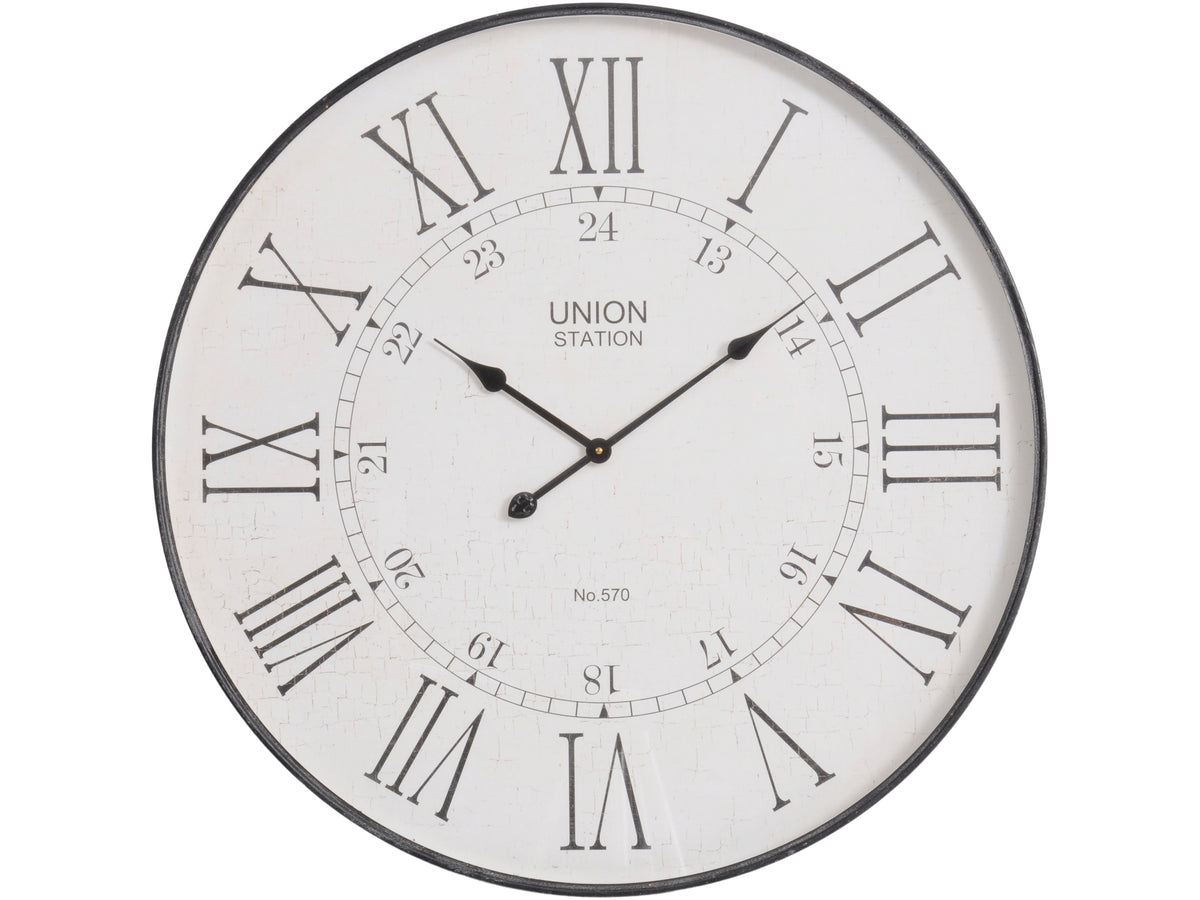 Front view of a round wall clock with a slim black rim, weathered white dial, tall Roman numerals, black hands, Union Station lettering and an inner 13–24 scale.