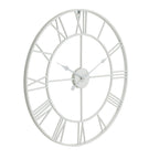 Angled front view of the white round skeleton wall clock, showing open Roman numerals, concentric rings and three shaped hands.