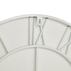 Rear close-up at the top of the white clock, showing the XII numeral framework, curved outer and inner rings and keyhole-cut hanging tab.